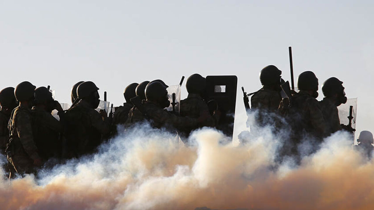 MIDEAST-CRISIS/SYRIA-TURKEY Turkish soldiers use tear gas to disperse Turkish Kurdish protesters near the Mursitpinar border crossing on the Turkish-Syrian border, in the Turkish town of Suruc in southeastern Sanliurfa province October 4, 2014. Turkish security forces broke up a pro-Kurdish demonstration in solidarity with Syrian Kurds, on the Turkish-Syrian border. REUTERS/Murad Sezer (TURKEY - Tags: MILITARY POLITICS CIVIL UNREST CONFLICT TPX IMAGES OF THE DAY) - RTR48X5W
