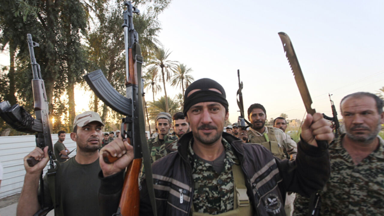 MIDEAST-CRISIS/IRAQ-EXECUTIONS Shi'ite fighters participate in an intensive security deployment against Islamic State militants in Jurf al-Sakhar October 26, 2014. After helping government forces break Islamic State's grip over a strategic town just south of Baghdad on Saturday, Shi'ite militias decided it was time for payback. To match story MIDEAST-CRISIS/IRAQ-EXECUTIONS REUTERS/Alaa Al-Marjani (IRAQ - Tags: MILITARY CIVIL UNREST POLITICS) - RTR4BO5H
