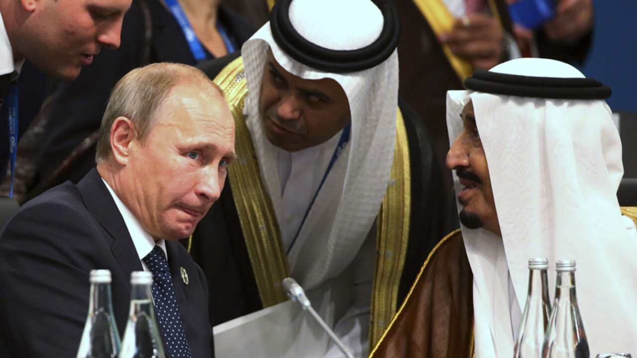 President of Russia Vladimir Putin (L) and Crown Prince Salman bin Abdulaziz Al Saud (R) of Saudi Arabia talk through their interpreters during a plenary session at the G20 leaders summit in Brisbane November 15, 2014. Western leaders attending the G20 summit blasted Putin on Saturday for the crisis in Ukraine, threatening further sanctions if Russia did not withdraw troops and weapons from its neighbouring nation. REUTERS/Rob Griffith/Pool   (AUSTRALIA - Tags: POLITICS BUSINESS ROYALS) - RTR4E8XK