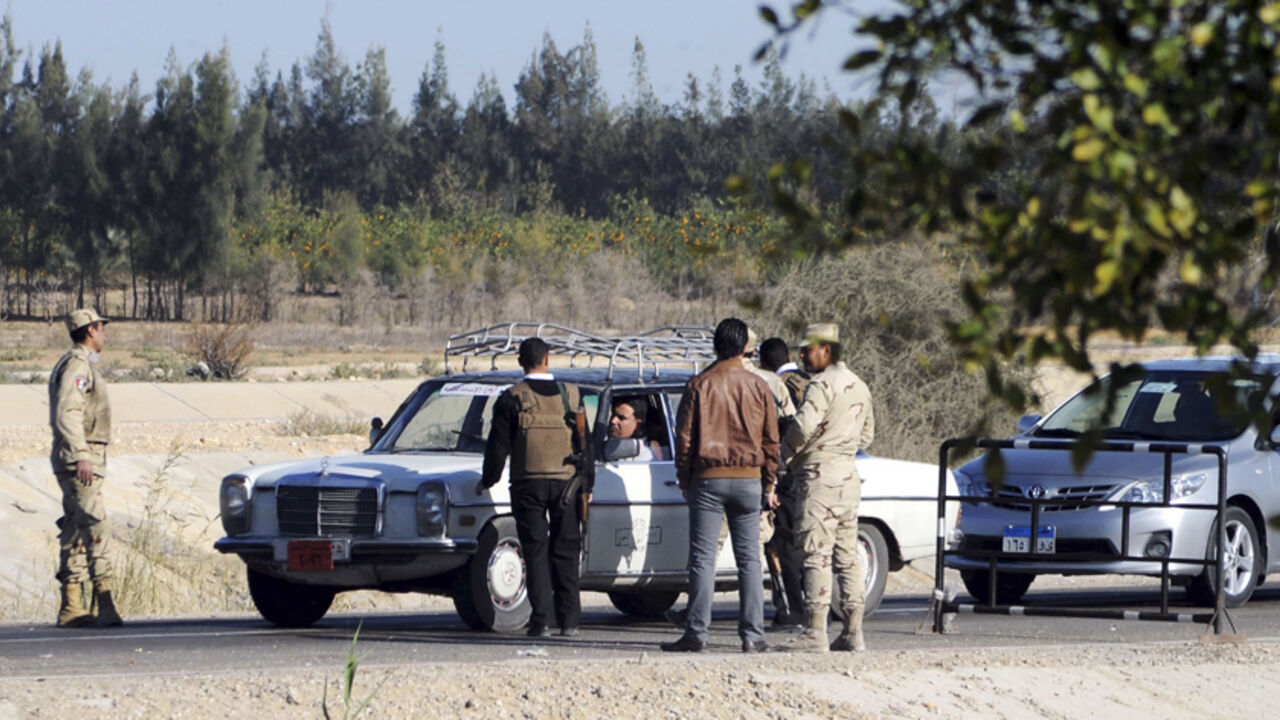 EGYPT-VIOLENCE/SINAI Egyptian security personnel check cars at a checkpoint near the site, where separate attacks on security forces in North Sinai on Thursday killed 30 people, in Arish, North Sinai, Egypt, January 31, 2015. President Abdel Fattah al-Sisi said on Saturday that Egypt faces a long, hard battle against militancy, days after one of the bloodiest attacks on security forces in years. On Thursday night, four separate attacks on security forces in North Sinai were among the worst in the country in years. Islamic Stat