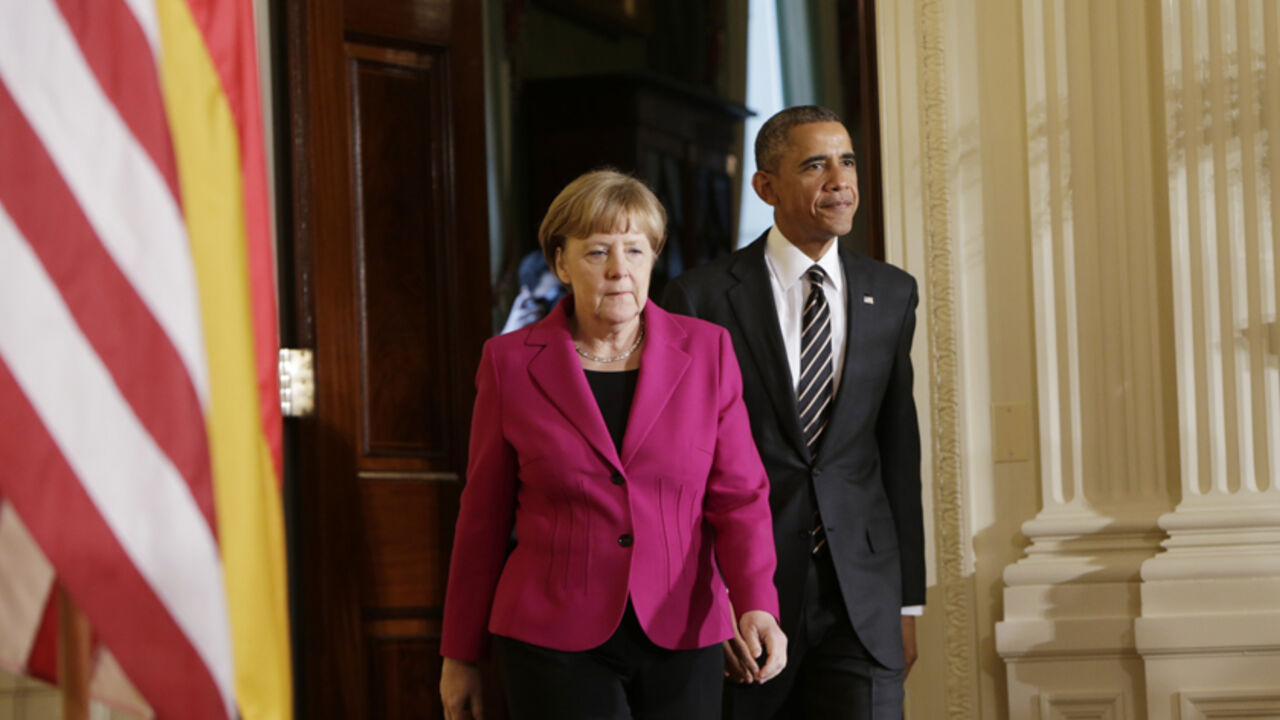 UKRAINE-CRISIS/OBAMA U. S. President Barack Obama and German Chancellor Angela Merkel arrive to address a joint news conference in the East Room of the White House in Washington February 9, 2015. REUTERS/Gary Cameron (UNITED STATES - Tags: POLITICS CIVIL UNREST) - RTR4OW3R