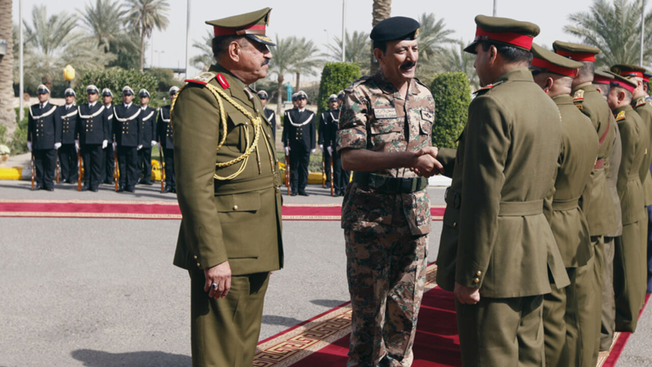 MIDEAST-CRISIS/IRAQ Jordanian Armed Forces Chief of Staff General Mashal Al Zaben (C) shakes hands with Iraqi military officers at the Defence Ministry in Baghdad February 11, 2015. Zaben held talks in Baghdad with his Iraqi counterpart as Arab states continued their attacks on Islamic State (IS) militants occupying chunks of Iraq and Syria. REUTERS/Ahmed Saad (IRAQ - Tags: CIVIL UNREST POLITICS CONFLICT MILITARY) - RTR4P57F