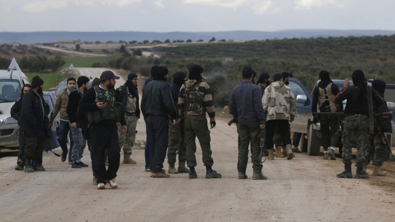 MIDEAST-CRISIS/SYRIA-ALEPPO Rebel fighters gather near the front line in Ratain village, north of Aleppo February 17, 2015. The Syrian army backed by allied militia have captured several villages near Aleppo in battles aimed at encircling the northern city and cutting off insurgent supply lines, a monitoring group said on Tuesday. The army also took villages including Bashkuwi and Sifat, while fighting raged in Hardatain and Ratain, said the Observatory, which tracks the Syrian conflict using sources on the ground. It added that at le