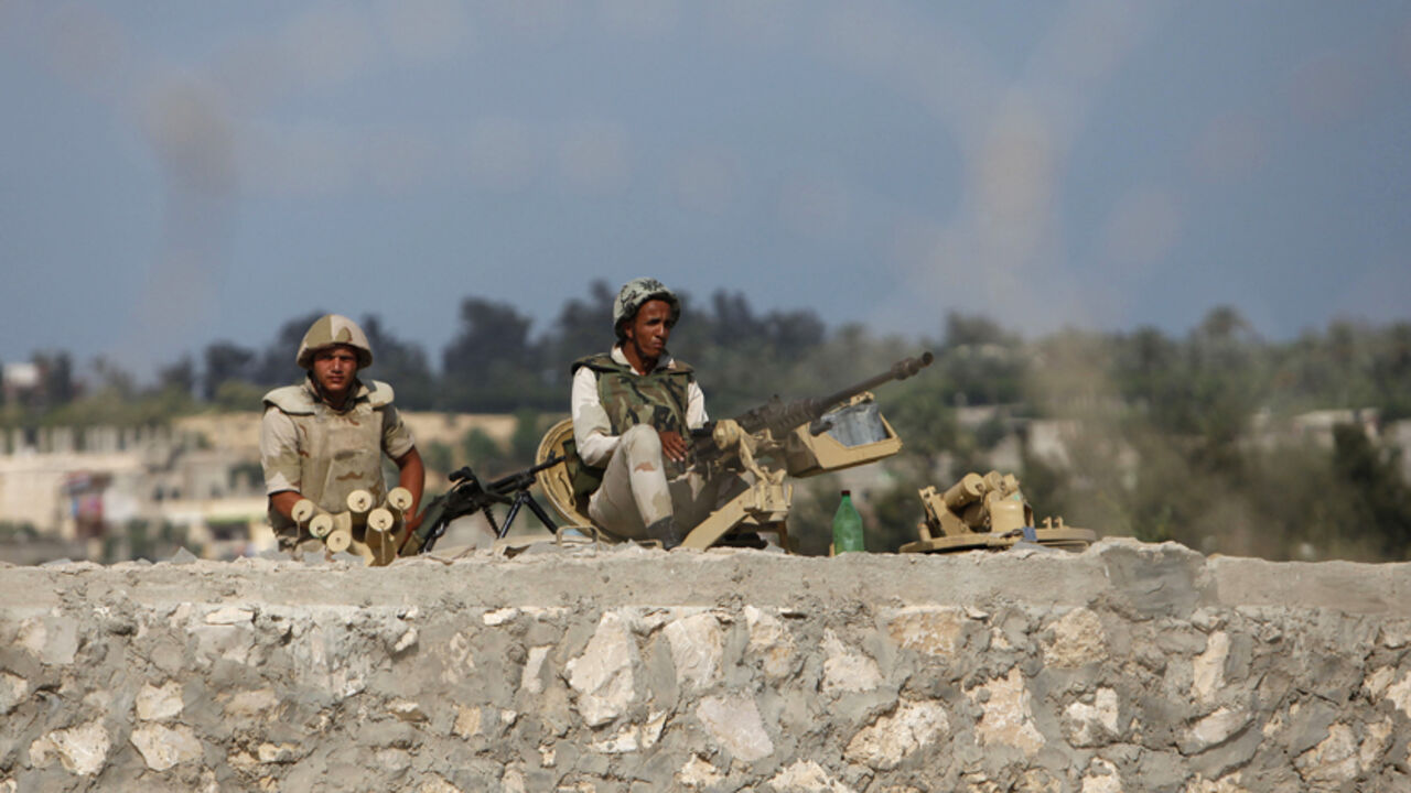 EGYPT-PROTESTS/PIPELINE Egyptian soldiers keep guard on the border between Egypt and southern Gaza Strip July 8, 2013. Armed men launched a series of attacks on Sunday on security checkpoints in the North Sinai towns of Sheikh Zuweid and El Arish close to Egypt's border with Israel and the Gaza Strip, and one soldier was killed. The Rafah border crossing between Egypt and Gaza Strip remained closed since Friday.
REUTERS/Ibraheem Abu Mustafa (GAZA - Tags: POLITICS CIVIL UNREST MILITARY) - RTX11GFK