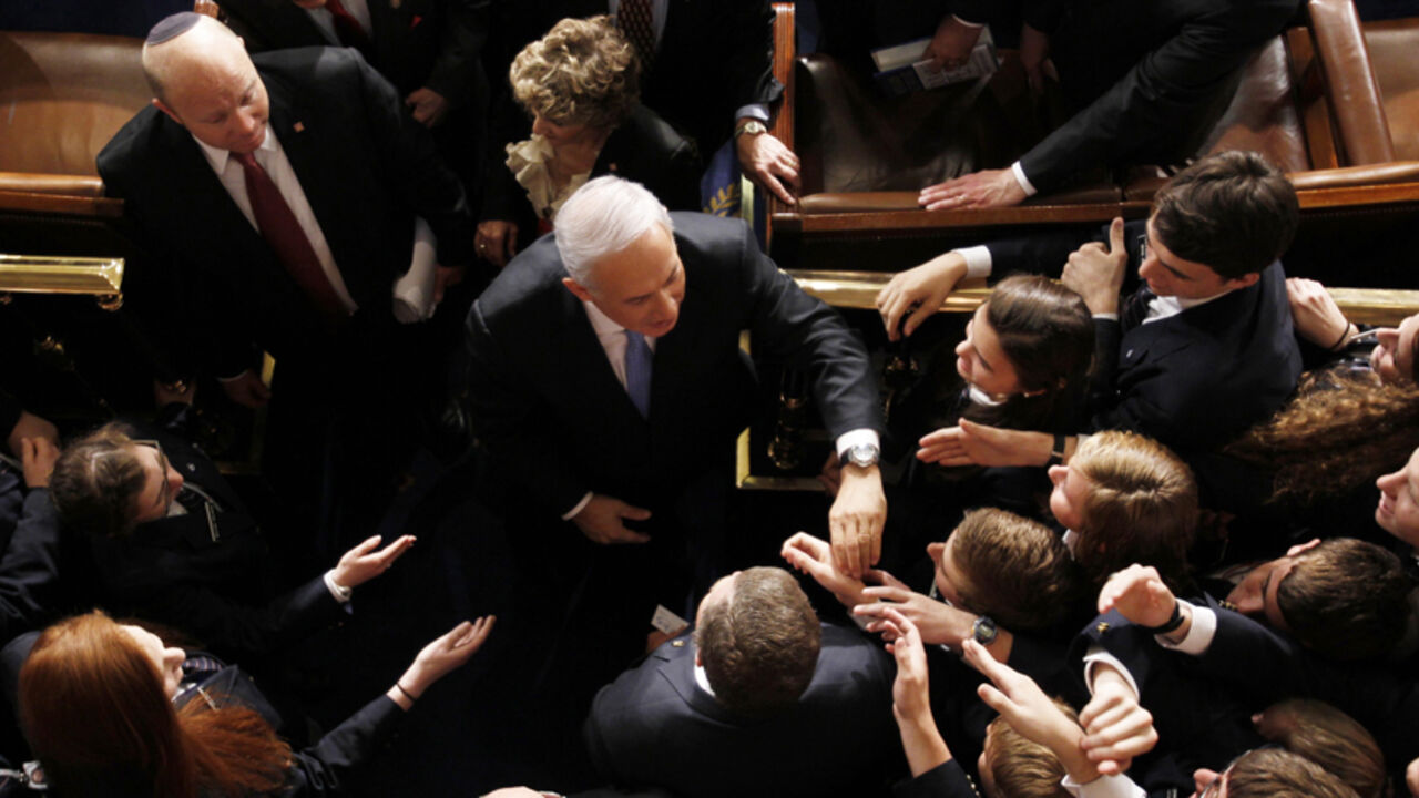 USA-ISRAEL/PALESTINIANS Israeli Prime Minister Benjamin Netanyahu shakes hands with U.S.congressional pages after his speech before a joint meeting of Congress in Washington, May 24, 2011. Netanyahu's vision for ending conflict with Palestinians put "more obstacles" in front of the Middle East peace process, the spokesman for the Palestinian President Mahmoud Abbas said. REUTERS/Jason Reed (UNITED STATES - Tags: POLITICS) - RTR2MUB0 - RTXYDJ1