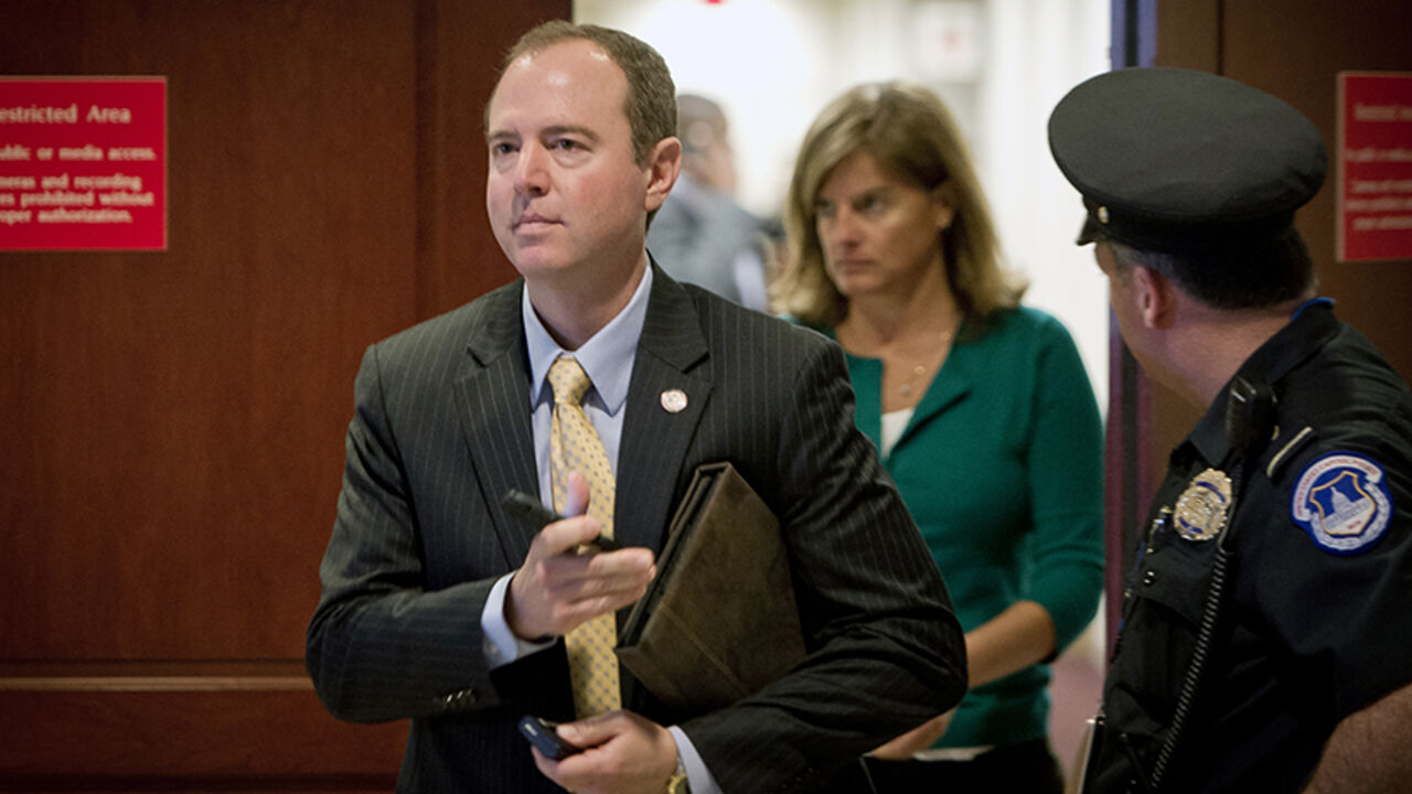 Was7068073 Rep. Adam Schiff (D-CA) leaves the room after a hearing at the US Capitol on November 16, 2012 in Washington,DC. Ex-CIA chief David Petraeus began his testimony before lawmakers Friday about the September 11 assault on the US mission in Benghazi, his first appearance since resigning suddenly a week ago. Packs of reporters and camera crews were on hand at the US Capitol hoping to catch Petraeus entering the highly-anticipated, closed-door hearing of the House Intelligence Committee but they were left disappo