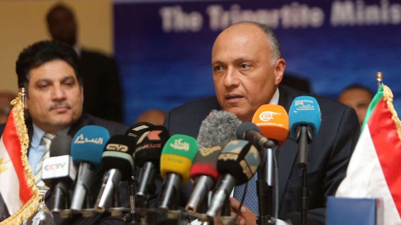 SUDAN-EGYPT-ETHIOPIA-NILE-RIVER-DIPLOMACY Egypt's foreign minister Sameh Shoukri speaks during a press conference with his Sudanese and Ethiopian counterparts in the early hours of March 6, 2015, on the sidelines of meetings in the Sudanese capital Khartoum, to announce they had reached an agreement on the sharing of Nile waters and Ethiopia's Grand Renaissance Dam. The principles of the use of the eastern Nile Basin and the Ethiopian Renaissance Dam will be submitted to the heads of the three states for approval. AFP PHOTO / ASHRAF SHAZLY (