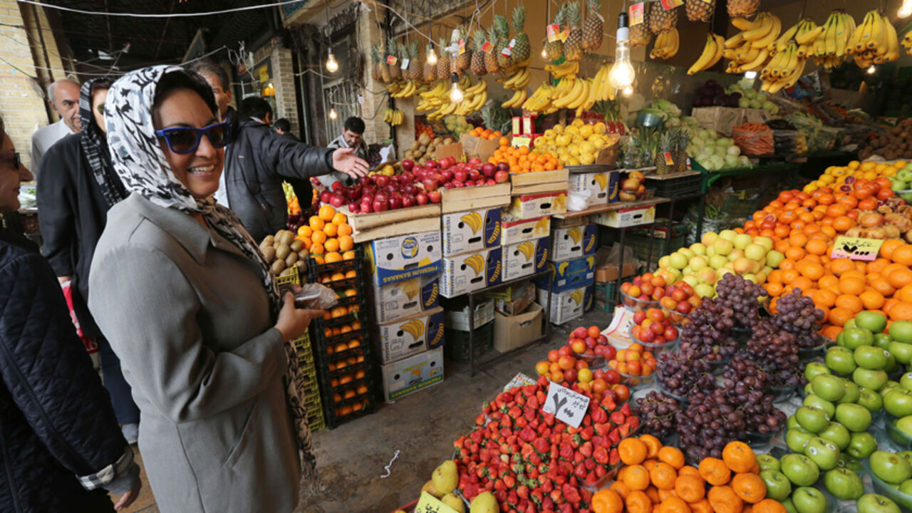 Nic6309292 Iranians shop for Noruz, the Persian New Year, at a market in Tehran on 19 March 2014. Iranians are preparing to celebrate Noruz, an ancient Zoroastrian feast starting 21 March, by buying flowers, green plants and goldfish. Noruz is calculated according to a solar calendar, this year marking 1393. AFP PHOTO/ATTA KENARE (Photo credit should read ATTA KENARE/AFP/Getty Images)