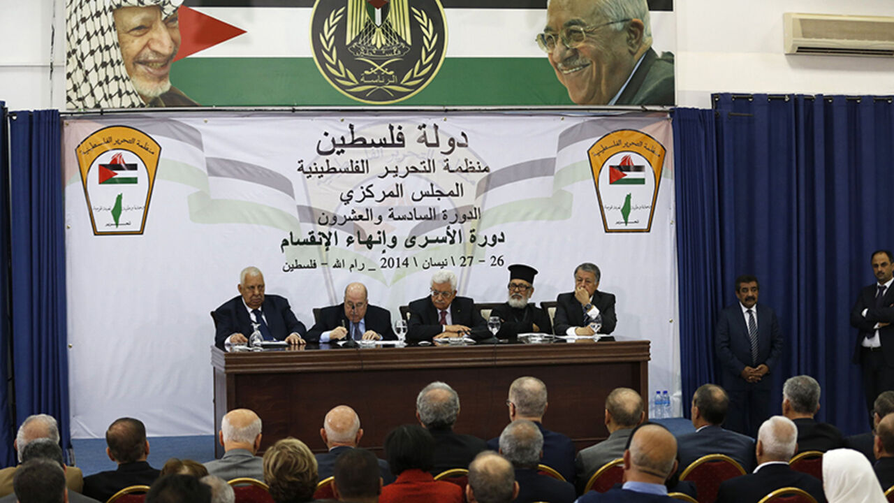 PALESTINIAN-ABBAS/TALKS Palestinian President Mahmoud Abbas (C) attends a meeting with the Palestinian Liberation Organization's (PLO) central council in the West Bank City of Ramallah April 26, 2014. Abbas said on Saturday he was still ready to extend stalled peace talks with Israel, as long as it met his long-standing demands to free prisoners and halt building on occupied land. REUTERS/Mohamad Torokman (WEST BANK - Tags: POLITICS) - RTR3MPN5