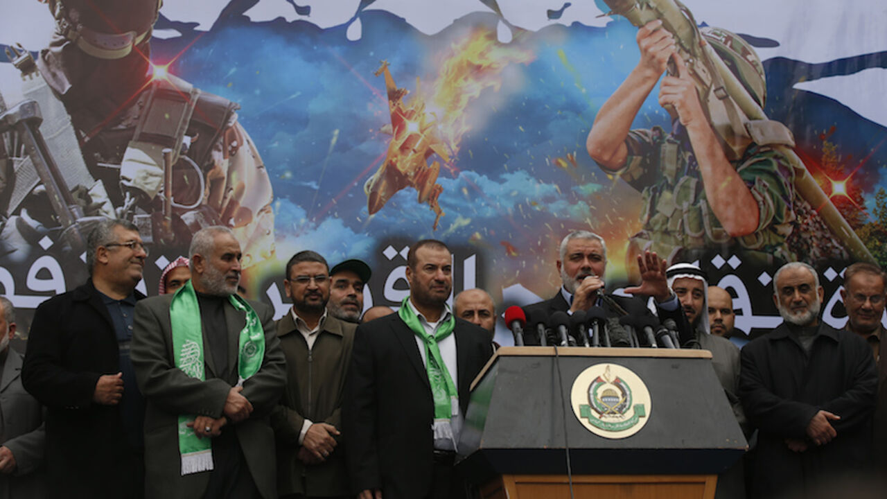 Senior Hamas leader Ismail Haniyeh gestures as he gives a speech during a rally ahead of the 27th anniversary of Hamas founding, in Jabaliya in the northern Gaza Strip Senior Hamas leader Ismail Haniyeh (5th R) gestures as he gives a speech during a rally ahead of the 27th anniversary of Hamas founding, in Jabaliya in the northern Gaza Strip December 12, 2014. REUTERS/Mohammed Salem (GAZA - Tags: POLITICS CIVIL UNREST) - RTR4HR3K