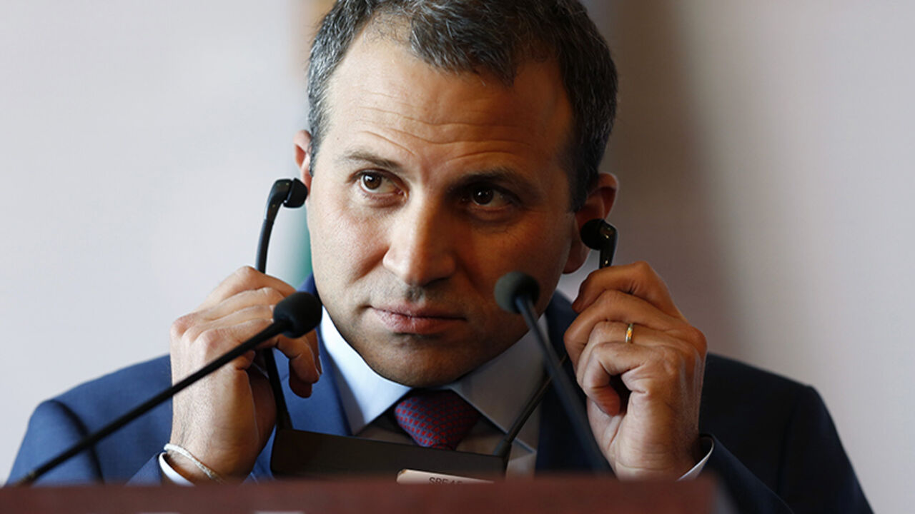 MEXICO-POLITICS/ Lebanon's Foreign Minister Gebran Bassil adjusts his earpiece during a news conference at the Foreign Affairs building in Mexico City, February 23, 2015. REUTERS/Edgard Garrido (MEXICO - Tags: POLITICS) - RTR4QVGR