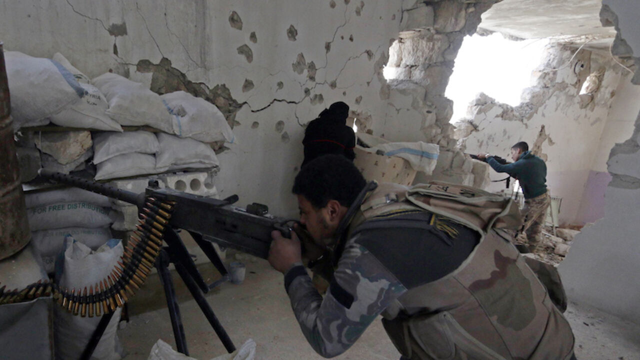 Rebel fighters of 'Al-Sultan Murad' brigade take positions inside a damaged building as they aim their weapons at the frontline in Handarat area, north of Aleppo Rebel fighters of 'Al-Sultan Murad' brigade take positions inside a damaged building as they aim their weapons at the frontline in Handarat area, north of Aleppo March 1, 2015. Picture taken March 1, 2015. REUTERS/Hosam Katan (SYRIA - Tags: POLITICS CIVIL UNREST CONFLICT MILITARY) - RTR4RRSL