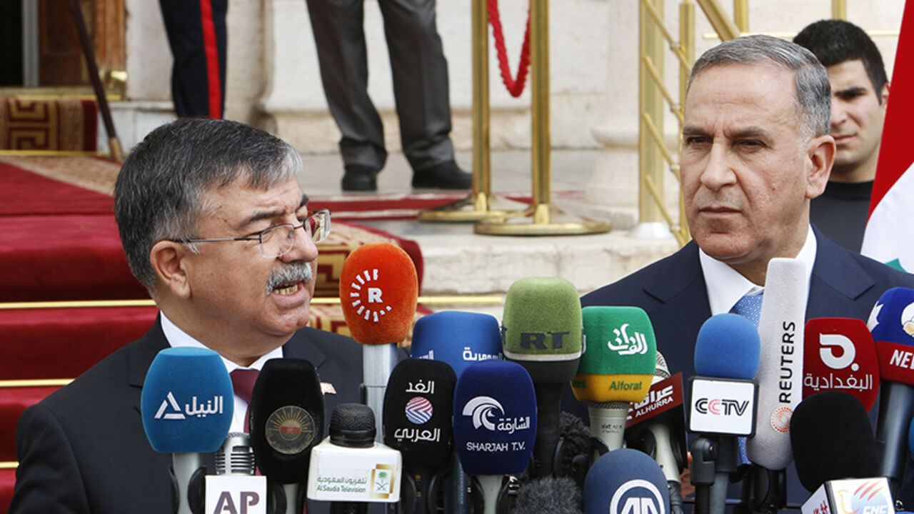 MIDEAST-CRISIS/IRAQ Turkey's Defence Minister Ismet Yilmaz (L) speaks during a news conference with Iraqi Defence Minister Khaled al-Obeidi in Baghdad March 4, 2015. REUTERS/Khalid al-Mousily (IRAQ - Tags: POLITICS) - RTR4S18I
