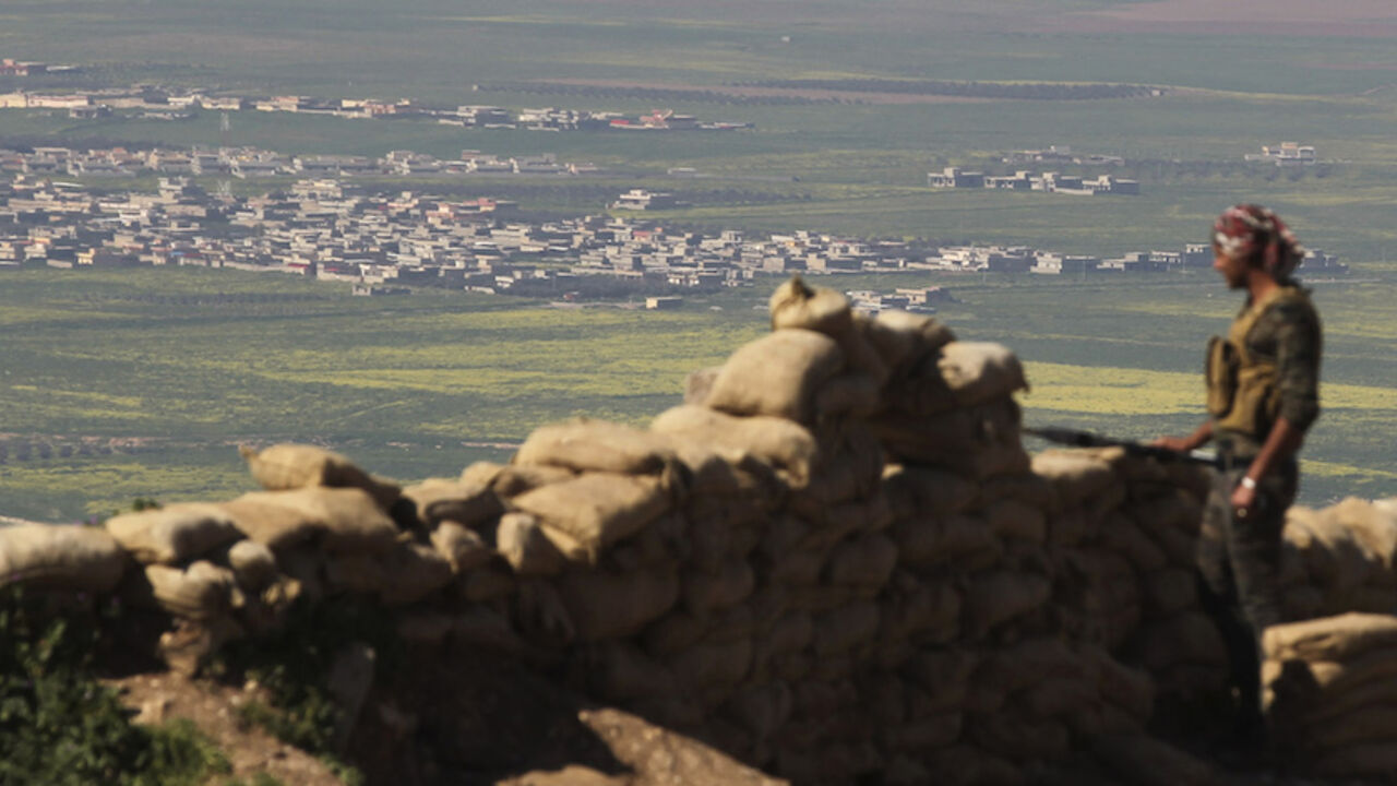 A member of the Kurdish Peshmerga forces stands guard at a security point on Bashiqa mountain, overlooking Islamic State held territories of Mosul, 12 km northeast of Mosul City, March 7, 2015.  REUTERS/Asmaa Waguih (IRAQ - Tags: POLITICS MILITARY CONFLICT) - RTR4SF1J