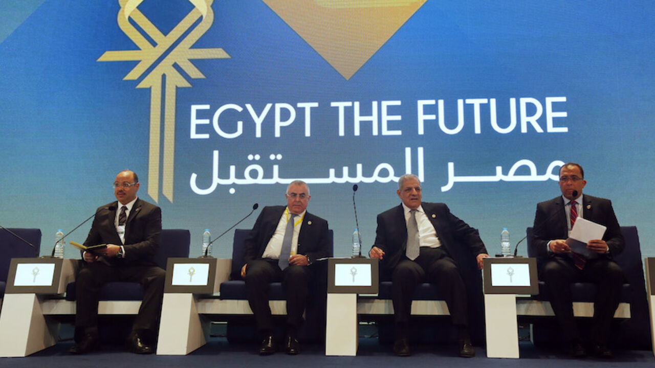 Egypt's Finance Minister Dimian, central bank governor Ramez, PM Mehleb and Planning Minister Arabi attend the EEDC in Sharm el-Sheikh Egypt's Finance Minister Hany Dimian (L-R), central bank governor Hisham Ramez, Prime Minister Ibrahim Mehleb and Planning Minister Ashraf al-Arabi attend the Egypt Economic Development Conference (EEDC) in Sharm el-Sheikh, in the South Sinai governorate, south of Cairo, March 14, 2015. Gulf Arab allies pledged a further $12 billion of investments and central bank deposits for Egypt at an international summit on Friday, a big boost to President Abdel Fattah al-Sisi as he tries to reform the economy after ye