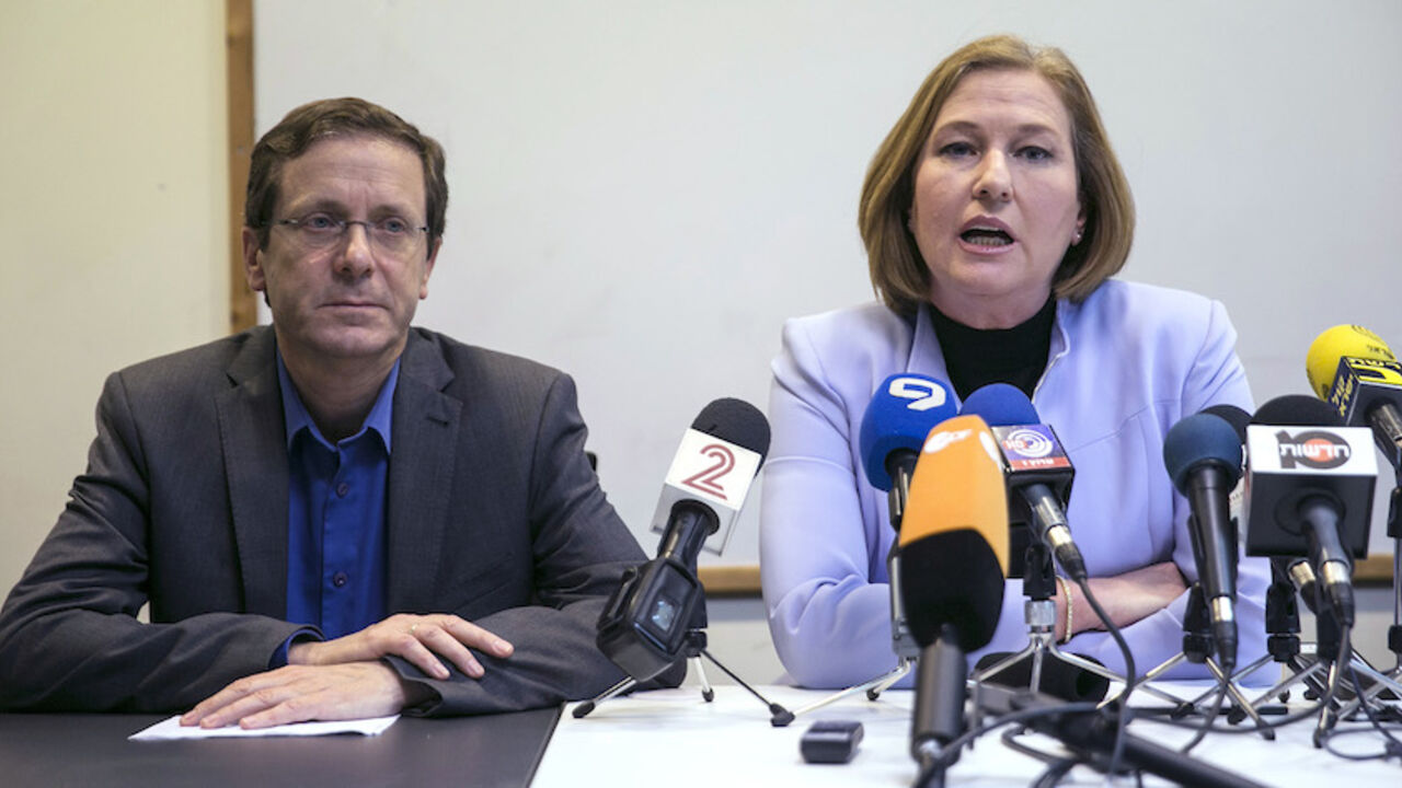 Herzog and Livni, co-leaders of Zionist Union, deliver a statement at the party headquarters in Tel Aviv Isaac Herzog (L) and Tzipi Livni, co-leaders of Zionist Union, deliver a statement at the party headquarters in Tel Aviv March 18, 2015. Israeli Prime Minster Benjamin Netanyahu pledged on Wednesday to form a new governing coalition quickly after an upset election victory that was built on a shift to the right and is likely to worsen a troubled relationship with the White House. With nearly all votes counted on Wednesday, Netanyahu's Likud had won 30 seats in the 120-member Knesset, comfortably defeating th