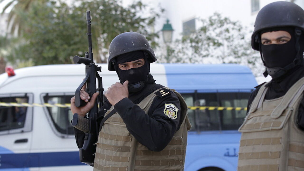 Tunisian policemen stand guard at the entrance of Bardo national museum in Tunis Tunisian policemen stand guard at the entrance of the Bardo national museum in Tunis March 19, 2015. Tunisia said it would deploy the army to major cities and arrested four people on Thursday after militant gunmen killed 20 foreign tourists visiting the national Bardo museum, the worst attack on the north African country in more than a decade. REUTERS/Anis Mili - RTR4U1PF