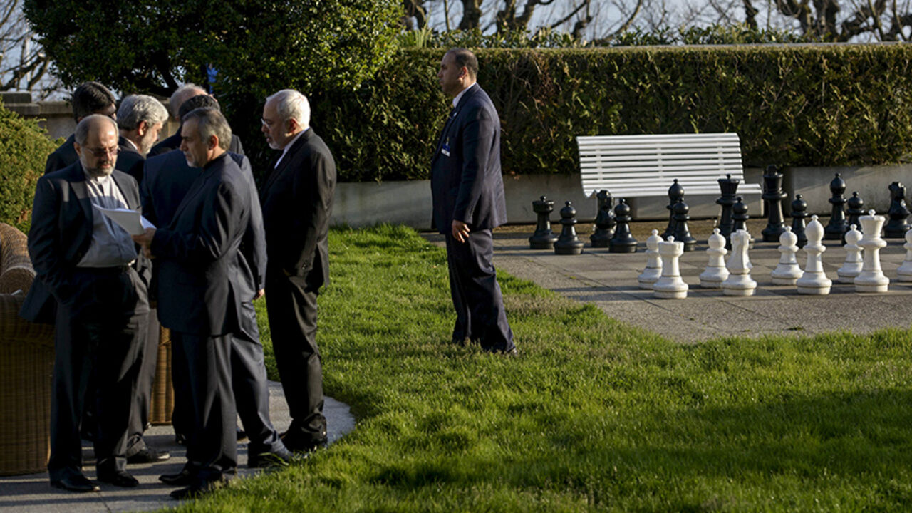 IRAN-NUCLEAR Iranian Foreign Minister Javad Zarif speaks with members of his delegation during talks at the Beau Rivage Palace Hotel in Lausanne March 27, 2015. Major powers and Iran were pushing each other for concessions on Friday ahead of an end-March deadline for a preliminary nuclear deal, with Tehran demanding an immediate end to sanctions and freedom to continue sensitive atomic research, officials said. REUTERS/Brendan Smialowski/Pool - RTR4V6PB