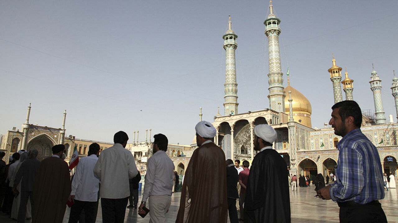 IRAN-ELECTION/ Men stand in line to vote during the Iranian presidential election at a mosque in Qom, 120 km (74.6 miles) south of Tehran June 14, 2013. Millions of Iranians voted to choose a new president on Friday, urged by Supreme Leader Ayatollah Ali Khamenei to turn out in force to discredit suggestions by arch foe the United States that the election would be unfair. REUTERS/Fars News/Mohammad Akhlagi (IRAN - Tags: POLITICS ELECTIONS) ATTENTION EDITORS - THIS IMAGE WAS PROVIDED BY A THIRD PARTY. FOR EDITORIAL USE ON