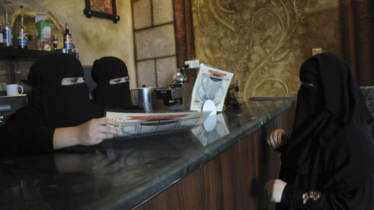 Veiled Saudi women work at a coffee shop in Tabuk, 1500 km (932 miles) from Riyadh Veiled Saudi women work at a coffee shop in Tabuk, 1500 km (932 miles) from Riyadh November 30, 2013. Saudi Arabia's crackdown on foreign workers has thrown millions of lives into turmoil and caused rioting in big cities, but the economy should benefit in the long run as Saudi nationals fill the gaps and cut their dependence on the state. REUTERS/Mohamed Alhwaity (SAUDI ARABIA - Tags: BUSINESS SOCIETY EMPLOYMENT) - RTX15YWV