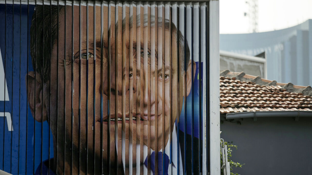 Israel's Prime Minister Benjamin Netanyahu (R) and Isaac Herzog, Co-leader of the centre-left Zionist Union, are pictured together as campaign billboards rotate in Tel Aviv, March 9, 2015. Israelis will vote in a parliamentary election on March 17, choosing among party lists of candidates to serve in the 120-seat Knesset. Currently, polls show Netanyahu's Likud party and the centre-left Zionist Union opposition running neck-and-neck, with each predicted to win around 24 seats in the Knesset.
REUTERS/Baz Ra