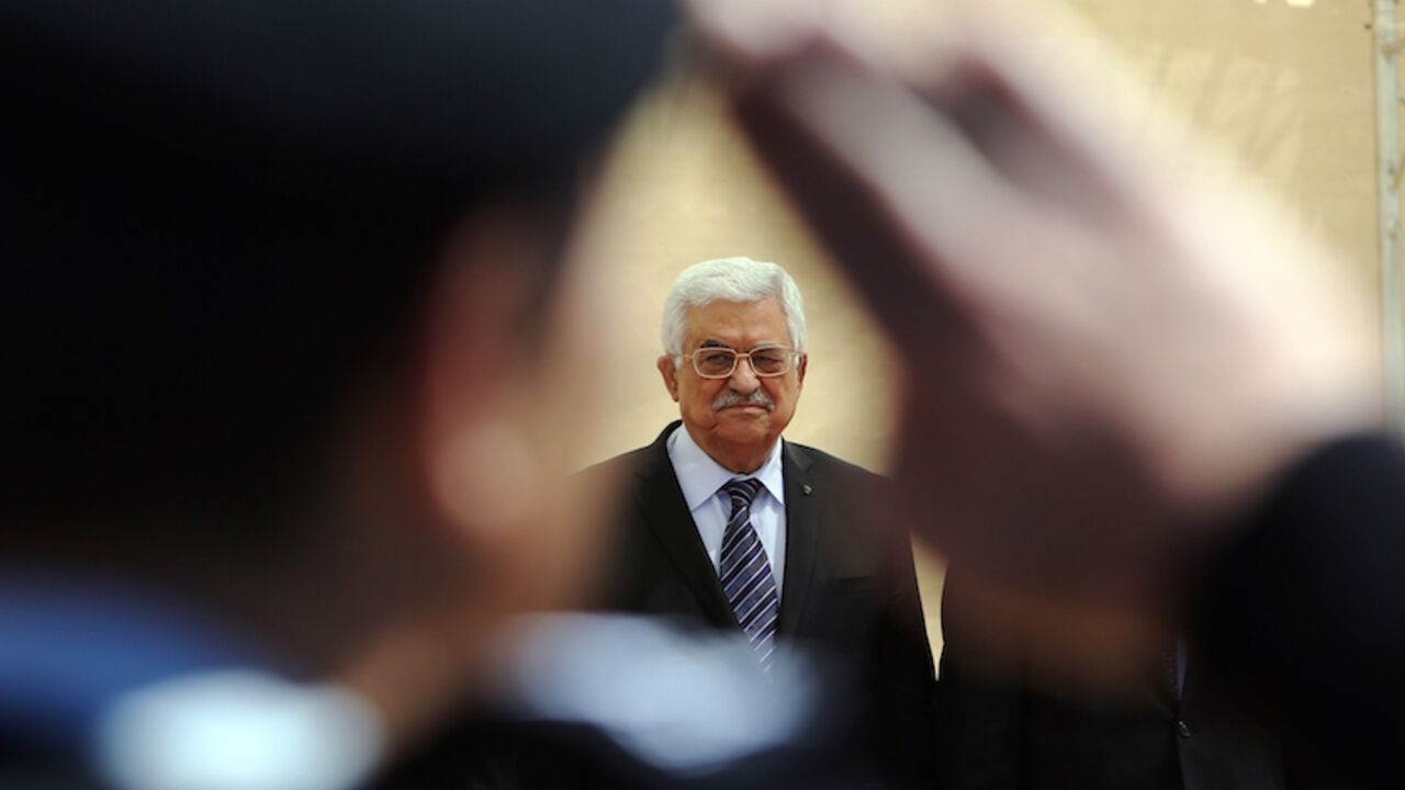 Nic6437573 Palestinian president Mahmud Abbas looks on during an opening ceremony of the "Istiqlal" (independence) garden in the West Bank city of Ramallah on April 5, 2015. In his speech Abbas called for "a solution to protect" the 18,000 Palestinian refugees still trapped in the Yarmouk camp, south of Damascus, besieged by the Syrian regime and almost entirely in the hands of jihadists. AFP PHOTO / ABBAS MOMANI (Photo credit should read ABBAS MOMANI/AFP/Getty Images)