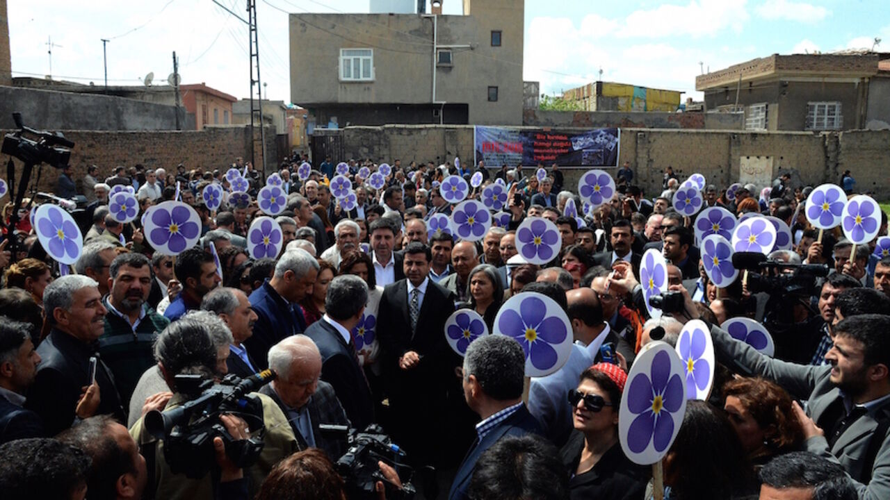 Par8157525 Co-leaders of the pro-Kurdish left-wing Peoples' Democracy Party (HDP) Selahattin Demirtas (C) attends a rally in front of the ruins of Surp Sarkis (Saint Sarkis) Armenian church in Diyarbakir, to commemorate the 100th anniversary of the 1915 mass killing of Armenians in the Ottoman Empire on April 24, 2015. Armenians demand that Turkey regognizes the genocide of 1,5 million of their kin killed between 1915 and 1917 by the Ottoman Empire, Turkey's predecessor. In rejecting the genocide label, Turkey says be