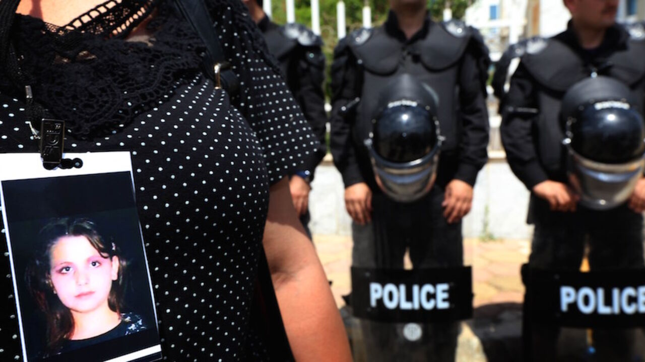 Nic6333934 An Iraqi Kurdish woman demonstrates in front of the Kurdistan Judicial Council offices in Arbil, the capital of the autonomous Kurdish region of northern Iraq, on May 29, 2014 denouncing the murder of 15-year-old Dunia Selman (portrait) by her 45-year-old husband the past week. AFP PHOTO / SAFIN HAMED (Photo credit should read SAFIN HAMED/AFP/Getty Images)