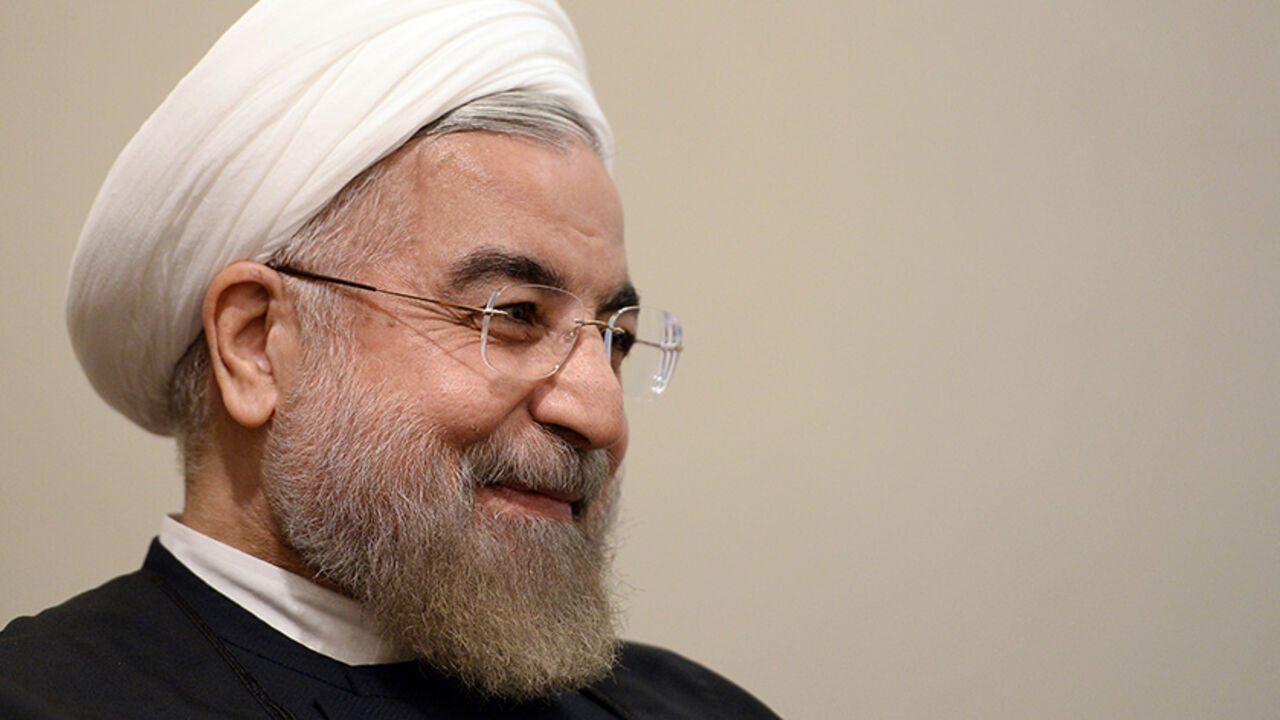 UN-CLIMATECHANGE/ Iran's President Hassan Rouhani smiles during a meeting with U.N. Secretary-General Ban Ki-moon on the sidelines of the U.N. General Assembly in New York September 23, 2014. REUTERS/Jewel Samad/Pool (UNITED STATES - Tags: POLITICS ENVIRONMENT) - RTR47FN9