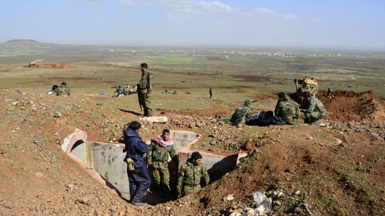 MIDEAST-CRISIS/SYRIA-SOUTH Fighters loyal to Syria's President Bashar Al-Assad rest on a hill after regaining control of Tal Fatima, a town south of Damascus, in the Daraa countryside March 1, 2015. Government forces say they've regained control of this and many other villages in the south - wresting them back from rebel hands.A general made the announcement on state television, saying a large number of Nusra Front fighters were killed and their weapons destroyed. The gains were said to happen on Friday and Saturday in a large offens