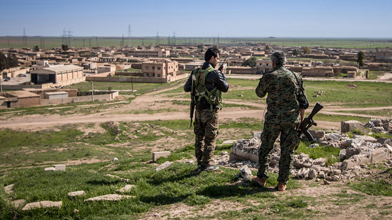 MIDEAST-CRISIS/SYRIA-KURDS Kurdish People's Protection Units (YPG) fighters stand with their weapons in Tel Hamis in Hasaka countryside March 1, 2015. Kurdish forces dealt a blow to Islamic State by capturing Tel Hamis, an important town, on Friday in the latest stage of a powerful offensive in northeast Syria, a Kurdish militia spokesman said. The capture of Tel Hamis was announced by the Kurdish YPG militia and confirmed by the Syrian Observatory for Human Rights, which monitors the country's civil war. REUTERS/Rodi Said (SYRIA - T