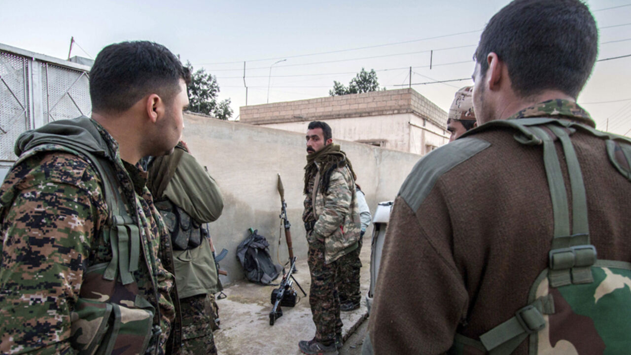 MIDEAST-CRISIS/SYRIA-NORTHEAST Kurdish People's Protection Units (YPG) fighters gather with their weapons in the Assyrian village of Tel Jumaa, north of Tel Tamr town March 4, 2015. The Kurdish People's Protection Units (YPG) have seized two towns and dozens of villages from Islamic State (IS) in an offensive that got under way on Feb. 21 in the strategically important Hasaka province that borders IS-held areas in Iraq. Picture taken March 4, 2015. REUTERS/Rodi Said (SYRIA - Tags: POLITICS CIVIL UNREST CONFLICT) - RTR4S816