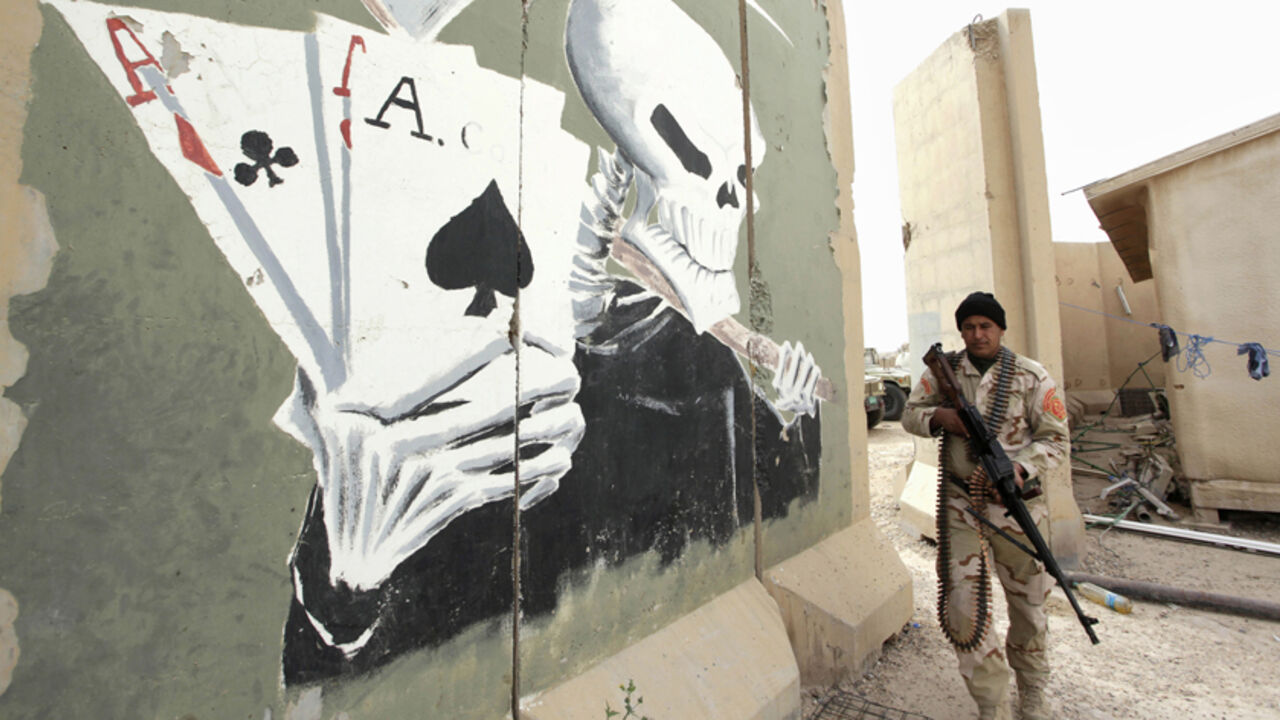 MIDEAST-CRISIS/IRAQ A member of the Iraqi security forces stands guard with his weapon at Camp Habbaniyah between the cities of Fallujah and Ramadi, March 12, 2015. Picture taken March 12, 2015.REUTERS/Alaa Al-Marjani (IRAQ - Tags: CIVIL UNREST POLITICS CONFLICT MILITARY SOCIETY) - RTR4T81N