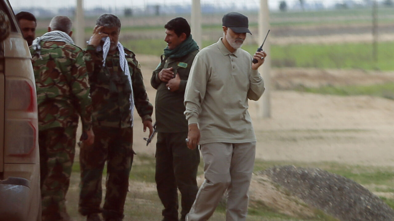 MIDEAST-CRISIS/IRAQ Iranian Revolutionary Guard Commander Qassem Soleimani uses a walkie-talkie at the frontline during offensive operations against Islamic State militants in the town of Tal Ksaiba in Salahuddin province March 8, 2015. Picture taken March 8, 2015. REUTERS/Stringer (IRAQ - Tags: CIVIL UNREST CONFLICT POLITICS) - RTR4TU0N
