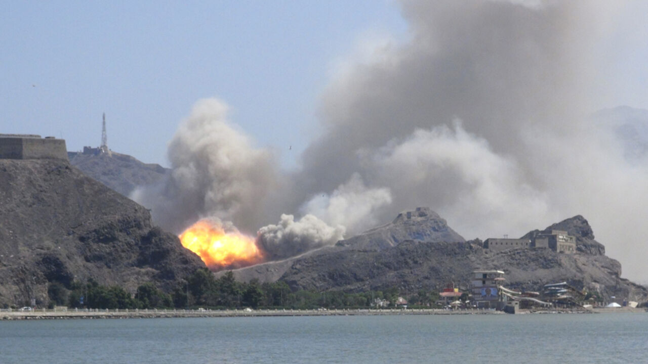YEMEN-SECURITY/EXPLOSIONS An arms depot explodes at the Jabal Hadeed military compound in Yemen's southern port city of Aden March 28, 2015. Explosions rocked Aden's largest arms depot on Saturday, sending flames and smoke into the sky above the southern Yemeni city, witnesses said. A Reuters correspondent saw fire and explosions at the Jabal Hadeed compound, which is close to residential and commercial properties. There was no immediate word of casualties. REUTERS/Nabeel Quaiti TPX IMAGES OF THE DAY - RTR4V93W