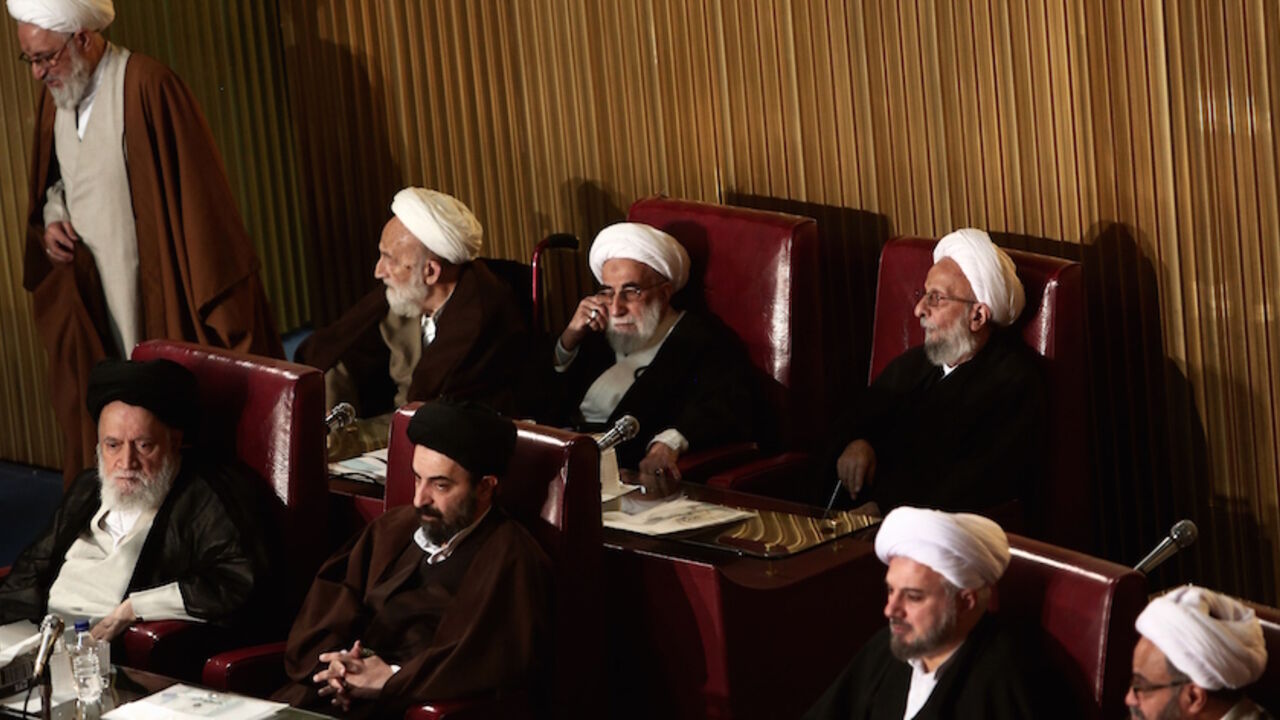 Nic6426483 Members of Iran's Assembly of Experts, Mohammad Taghi Mesbah-Yazdi (up-R) and head of the Guardian Council, Ahmad Janati (up-C), attend a session to appoint a new chairman on March 10, 2015 in Tehran. The Assembly of Experts, the clerics who appoint and can dismiss the country's supreme leader, picked the ultraconservative Ayatollah Mohammad Yazdi as their new chairman in a surprise appointment. AFP PHOTO / BEHROUZ MEHRI (Photo credit should read BEHROUZ MEHRI/AFP/Getty Images)