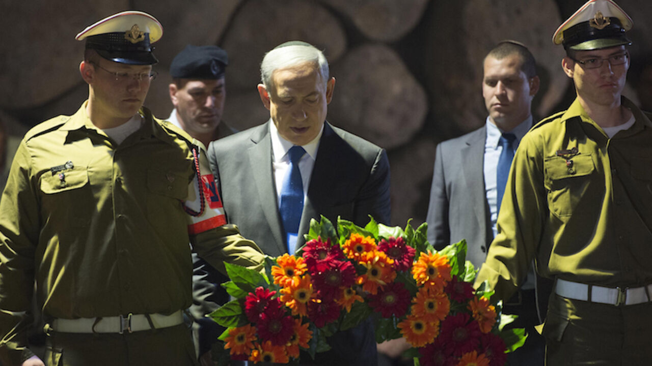 84775335 JERUSALEM, ISRAEL - APRIL 16: (ISRAEL OUT) In this handout from the Israeli GPO, Prime Minister Benjamin Netanyahu lays a wreath during a ceremony to mark Holocaust Remembrance Day at the Yad Vashem Museum on April 16, 2015 in Jerusalem, Israel. Traffic stopped and people stood to attention as a two minutes silence was observed in Israel, with sirens sounding across the country to mark the annual Holocaust Remembrance Day. (Photo by Amos Ben Gershom/GPO via Getty Images)