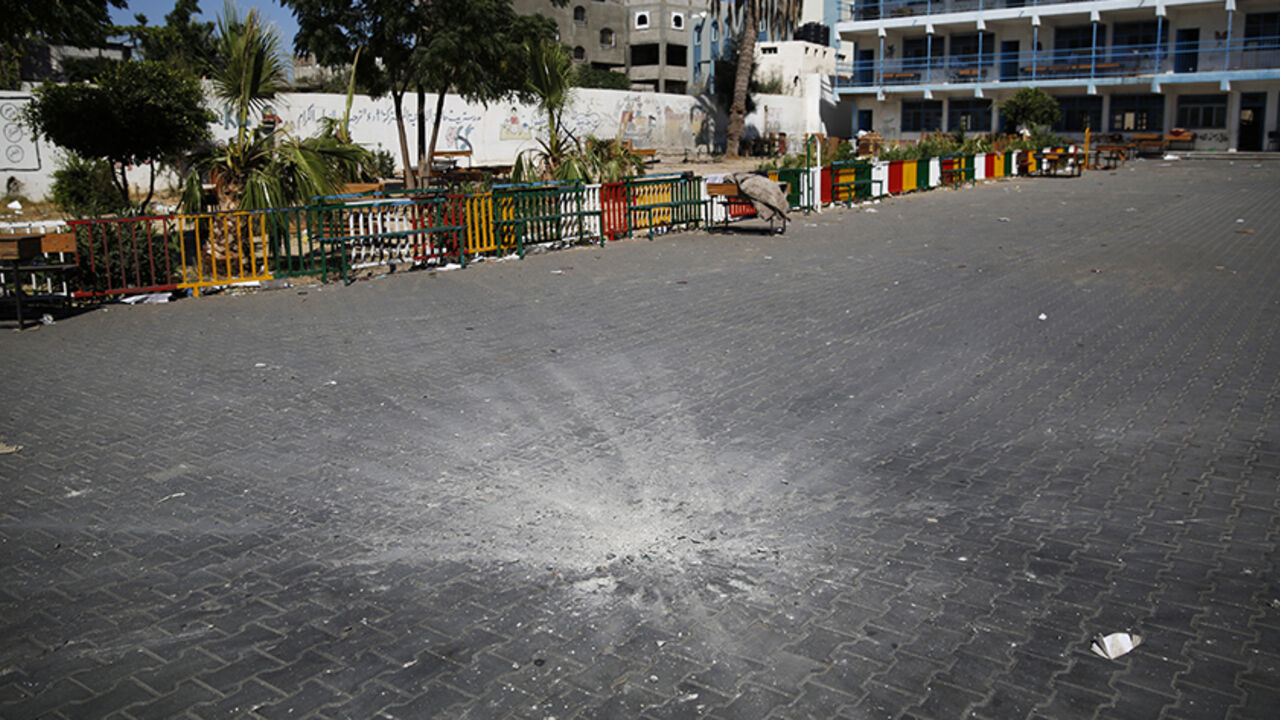 MIDEAST-GAZA/ A crater marks the centre of a courtyard at a United Nations-run school sheltering Palestinians displaced by an Israeli ground offensive, that police said was hit by an Israeli shell, in Beit Hanoun in the northern Gaza Strip July 24, 2014. At least 15 people were killed and many wounded on Thursday when Israeli forces shelled a U.N.-run school sheltering Palestinian refugees in northern Gaza, said a spokesman for the Gaza health ministry, Ashraf al-Qidra. Chris Gunness, spokesman for the main U.N. agency i
