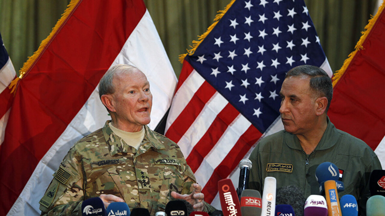 MIDEAST CRISIS/ U.S. Army General Martin Dempsey (L) speaks during news conference with Iraq's Defence Minister Khaled al-Obeidi in Baghdad March 9, 2015. REUTERS/Ahmed Saad (IRAQ - Tags: POLITICS CIVIL UNREST CONFLICT) - RTR4SM9Z