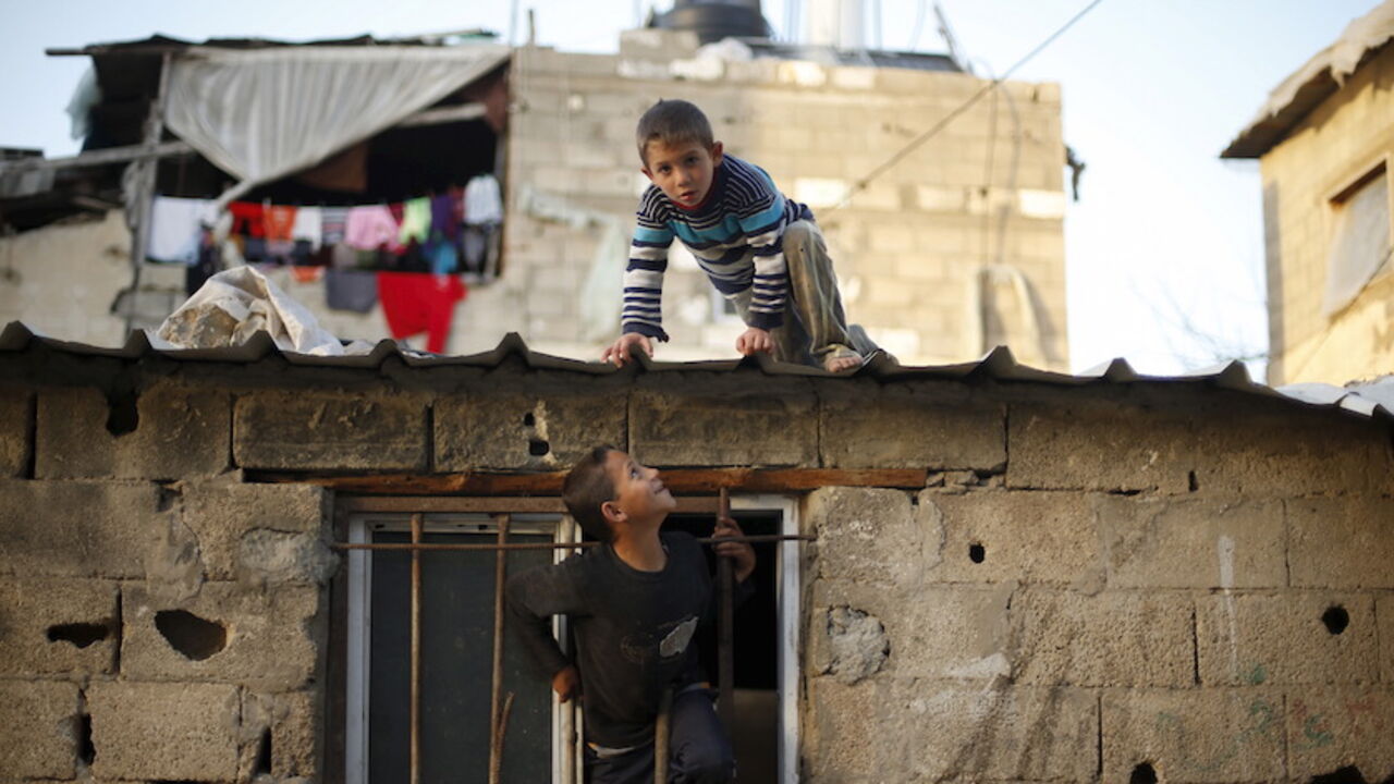 Palestinian boys play at their family house in Biet Lahiya town in the northern Gaza Strip March 24, 2015. REUTERS/Mohammed Salem 







 - RTR4UP0K