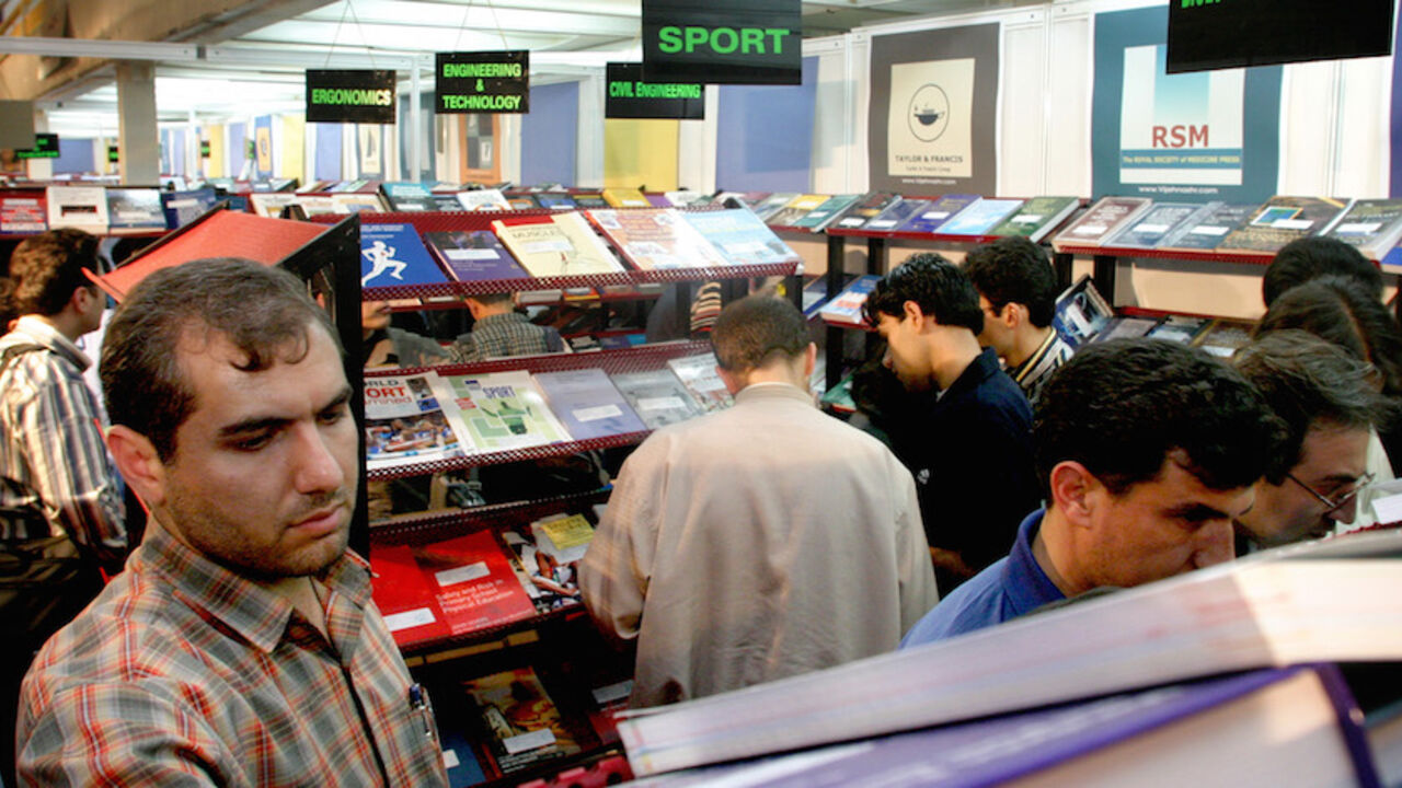 TEHRAN Iranians visit Tehran's annual book fair on May 5, 2004. Persian is famed as the melodic, courtly language of mediaeval poets such as Omar Khayyam and Hafez, but it is a dictionary of vulgar street slang that is taking Iranian literary circles by storm. REUTERS/Morteza Nikoubazl CJO/CRB - RTRIUKD