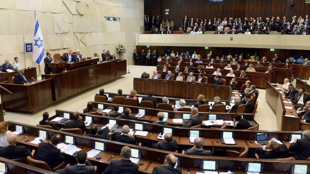 PALESTINIANS-ISRAEL/FRANCE France's President Francois Hollande addresses the Knesset, the Israeli parliament, in Jerusalem November 18, 2013. Hollande called on Israel on Monday to halt settlement building on occupied territory, saying it hampers chances for a peace agreement with the Palestinians. REUTERS/Debbie Hill/Pool (JERUSALEM - Tags: POLITICS) - RTX15J2L
