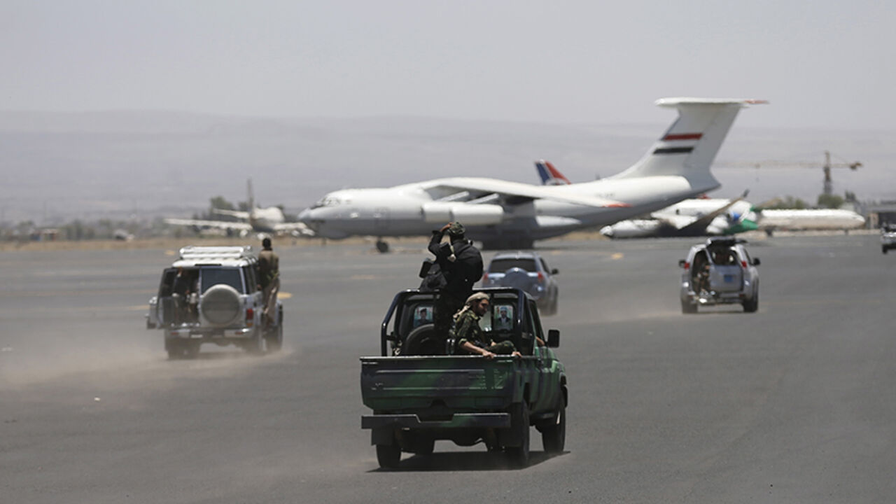 YEMEN-SECURITY/ Houthi militants ride on a patrol truck at the international airport of Yemen's capital Sanaa, April 29, 2015. Jets from a Saudi-led alliance destroyed the runway of Yemen's Sanaa airport on Tuesday to prevent an Iranian plane from landing there, Saudi Arabia said, as fighting across the country killed at least 30 people. Airport officials said the strikes set a civilian aircraft operated by Yemeni Felix Airways ablaze. REUTERS/Khaled Abdullah - RTX1ATYY