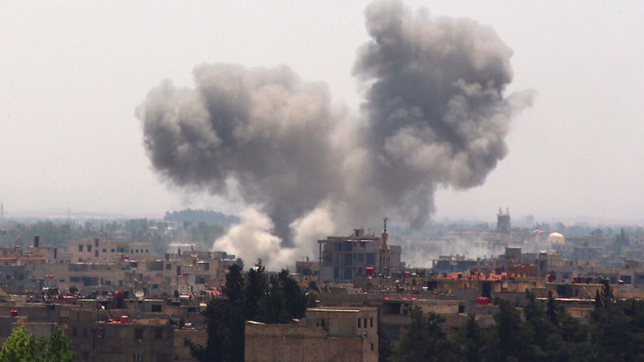 MIDEAST-CRISIS/SYRIA Smoke rises from what activists said was due to shelling by forces loyal to Syria's president Bashar Al-Assad on the outskirts of Damascus city in the eastern Damascus suburb of Ghouta May 21, 2015. REUTERS/Diaa Al-Din - RTX1DYKI