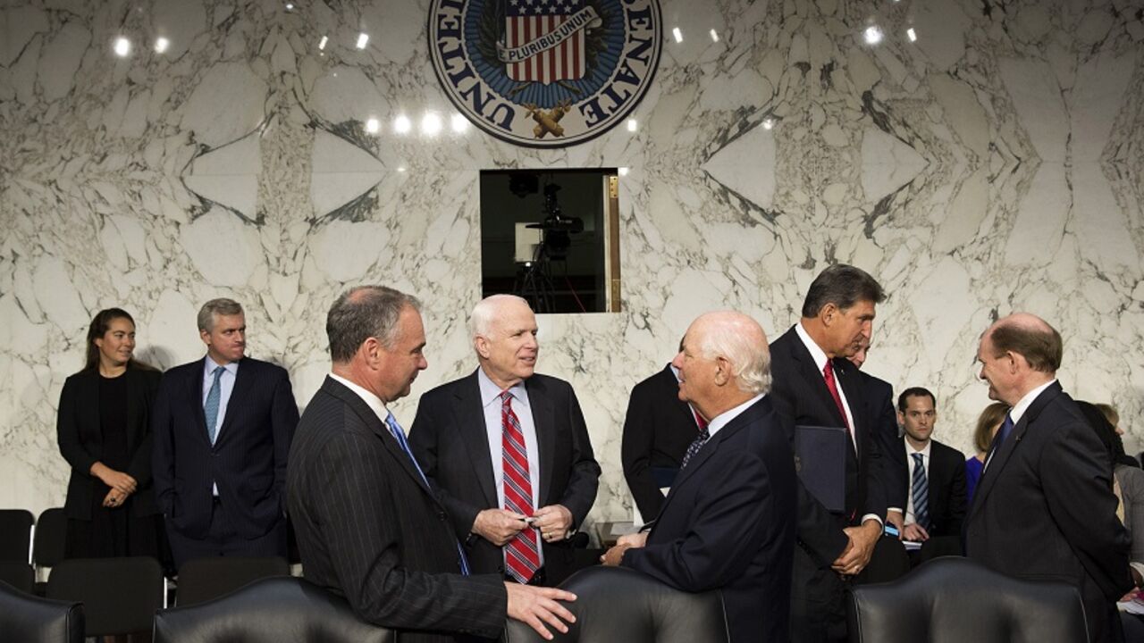 Senators McCain, Kaine and Cardin speak before before a Senate Foreign Relations Committee hearing in Washington Senators John McCain (R-AZ) (center), Tim Kaine (D-VA) and Ben Cardin (D-MD) (right) speak before Chairman of the Joint Chiefs General Martin E. Dempsey, John Kerry, U.S. secretary of state, and Charles 'Chuck' Hagel, secretary of defense, arrive to present the administration's case for U.S. military action against Syria to a Senate Foreign Relations Committee hearing on September 3, 2013. President Barack Obama on Tuesday urged quick congressional action authorizing the use of military force against Syria
