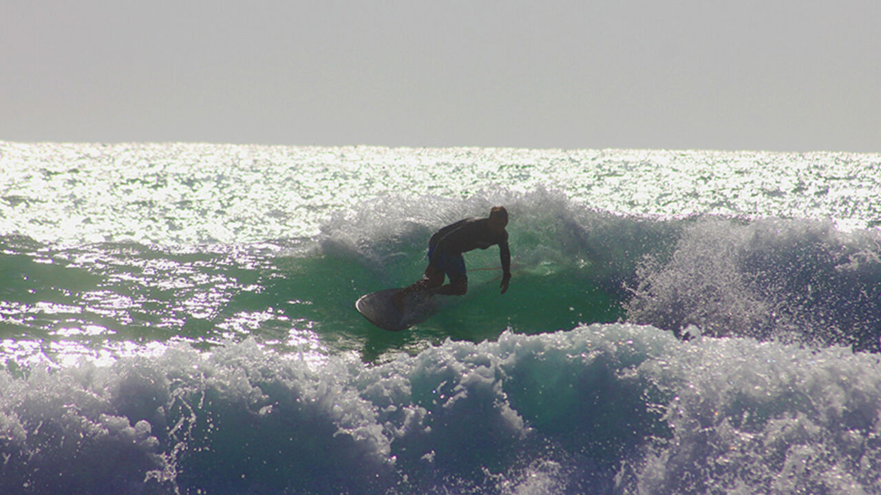 Surfer Catches A Wave in Jiyeh, Lebanon Surfer Catches A Wave in Jiyeh, Lebanon