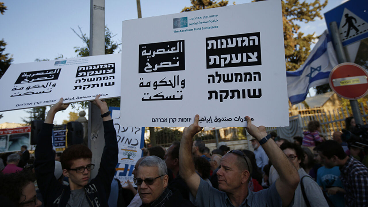 ISRAEL-CHURCH/ Christians, Muslims and Jews take part in a protest in Jerusalem, against attacks by suspected far-right Israelis, dubbed "price tagging", May 11, 2014. The top Roman Catholic cleric in the Holy Land said on Sunday a spate of attacks he described as acts of terror against the church were poisoning the atmosphere ahead of this month's visit by Pope Francis, and urged Israel to arrest more perpetrators. REUTERS/Ronen Zvulun (JERUSALEM - Tags: POLITICS RELIGION CIVIL UNREST) - RTR3OOUL