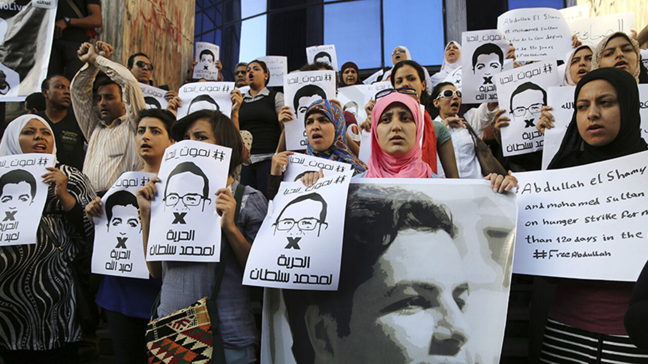 EGYPT/ Protesters rally in support of Al Jazeera journalists Abdullah al-Shami and Mohammed Sultan,who were detained by Egyptian authorities, in front of the Press Syndicate in Cairo, June 1, 2014. According to Al Jazeera's website, the two journalists have been in detention since August last year for providing information to the Muslim Brotherhood. The government has declared the Brotherhood a "terrorist group". The Brotherhood says it is a peaceful organisation. REUTERS/Mohamed Abd El Ghany (EGYPT - Tags: POLITI