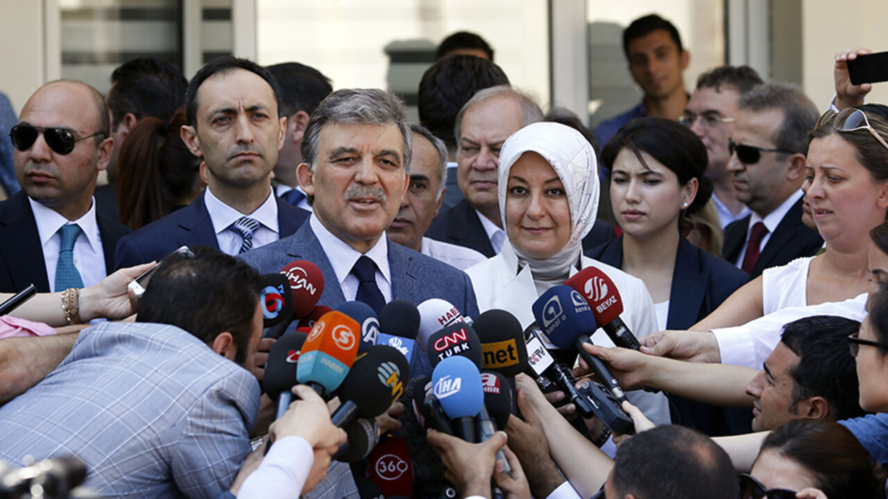 TURKEY-ELECTION/ Turkey's incumbent President Abdullah Gul and his wife Hayrunnisa Gul talk to the media as they leave a polling station after casting their votes in Ankara August 10, 2014. Turks began voting on Sunday with Tayyip Erdogan poised to become the country's first elected president, fulfilling his dream of what he calls a "new Turkey" and his opponents say will be an increasingly authoritarian nation. REUTERS/Umit Bektas (TURKEY - Tags: POLITICS ELECTIONS) - RTR41UXL