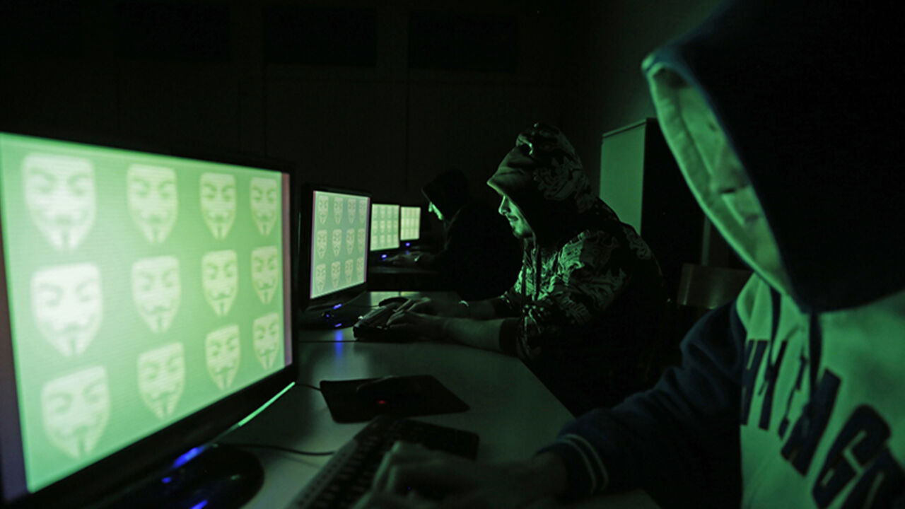 HACKING-TOOL/ People pose in front of a display showing the word 'cyber' in binary code, in this picture illustration taken in Zenica December 27, 2014. A previously undisclosed hacking campaign against military targets in Israel and Europe is probably backed by a country that misused security-testing software to cover its tracks and enhance its capability, researchers said. Picture taken December 27, 2014. REUTERS/Dado Ruvic (BOSNIA AND HERZEGOVINA - Tags: SCIENCE TECHNOLOGY CRIME LAW) - RTR4JEYM